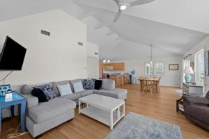 a living room with a couch and a table at 7675 - Sweet Caroline in Avon