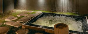 a bath tub filled with water in at Casa Chichipicas Hotel Boutique in Valle de Bravo