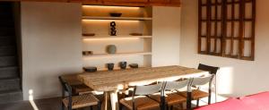 a dining room with a wooden table and chairs at Casa Chichipicas Hotel Boutique in Valle de Bravo
