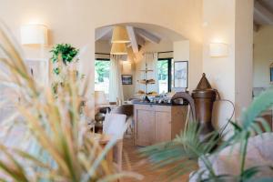 a kitchen with a sink and a counter top at Relais Rossar Boutique Hotel Garda & Hills in Costermano