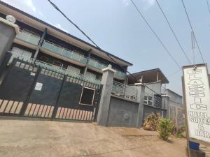 a building with a sign in front of it at Classic Hotel by TWM in Ibadan