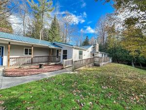 a house with a large yard with a porch at Blue Ribbon Cabin in Farwell