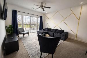 a living room with a couch and a table at Designer UAB Condo King Bed Balcony View 2 in Birmingham