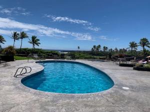 a swimming pool in the middle of a patio at 41 Turtle Hut in Pahala