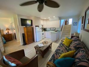 a living room with a couch and a table at 71 Dramatic Ocean and Lava in Pahala