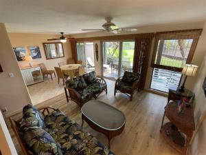 a living room with a couch and a table at 16 Two Bedroom Two Bath Condo in Pahala