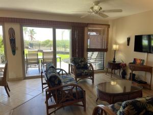 a living room with a couch and a table at 16 Two Bedroom Two Bath Condo in Pahala