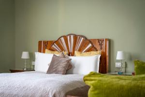 a bedroom with a large bed with white sheets and pillows at Opera Boutique B&B in Florence