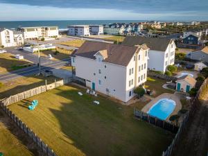 an aerial view of a house and a pool at 5195 - Captain's Choice in Kill Devil Hills