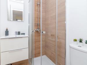 a shower with a glass door in a bathroom at Akisol Olhão Sweet in Olhão +18 photos
