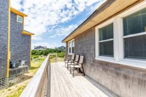 a deck with chairs on the side of a house at 7847 - Summerset in Frisco