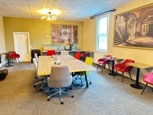 a dining room with tables and chairs in it at Pallas Hotels in Darmstadt