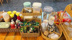 a group of baskets sitting on a table with food at Neo cafe and hotel 2 in Sathani Maruan