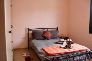 a bedroom with a bed with a tray of food on it at Arcadia di Vito in Tripoli