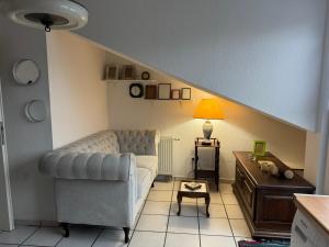 a living room with a couch and a table at your accomodation in Aachen in Aachen