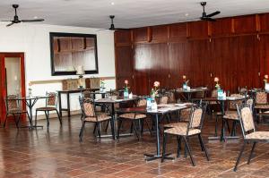 a dining room with tables and chairs at Ocean View Villas B09 in Port Edward