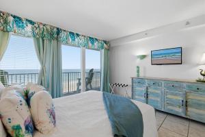 a bedroom with a bed and a view of the ocean at Daytona Beach in Daytona Beach +27 photos