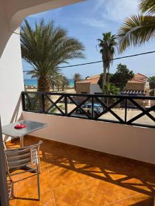 a balcony with a table and a view of the beach at Aparthotel Santa Maria Beach in Santa Maria