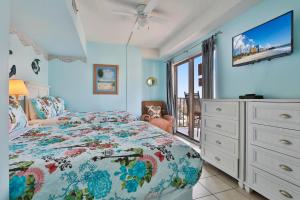 a bedroom with a bed and a dresser at The Palace Resort #1114 in Myrtle Beach +31 photos