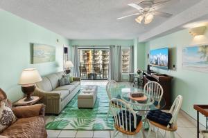 a living room with a couch and a table at The Palace Resort #1114 in Myrtle Beach