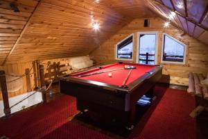 a room with a pool table in a cabin at Casa Nobilă in Bran +104 photos