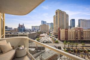 a balcony with a view of the city at MGM Signature Tower 2 8th Floor 2-Suite Strip View Balcony No Resort Fee in Las Vegas