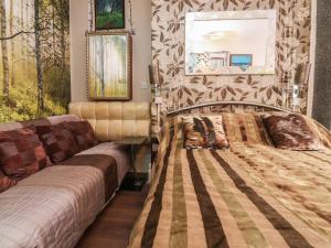 a bedroom with two beds and paintings on the wall at Number 3 in Blackpool