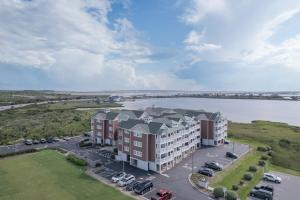 an aerial view of a building with a parking lot at C103A - Sweet Sound Memories in Nags Head