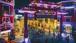 a rendering of a city street at night at Grand Central Hotel- Vinhomes Ocean Park 3 in Ðình Loan