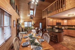 a dining room and kitchen with a table and chairs at Nestled Inn in Townsend