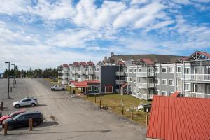 arial view of a city with cars parked in a parking lot at ML 345 Ski-InOut Slope Views Sleeps 6 Steps to Ballhooter in Snowshoe