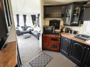 a kitchen and living room in an rv at Towervans Z11 in Mablethorpe