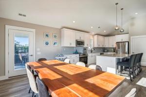 a kitchen with a wooden table and a dining room at 4920 - Stress Less II in Kitty Hawk +61 photos