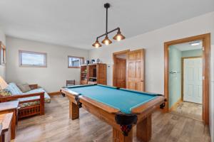 a living room with a pool table in it at 7865 - Peridot in Frisco