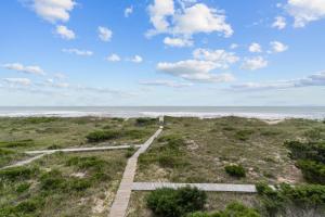 a path to the beach with the ocean in the background at 7865 - Peridot in Frisco