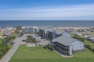an aerial view of a apartment complex next to the ocean at 7081 - Sea View in Rodanthe