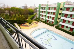 a swimming pool on a balcony of a building at Residence Roberta - Agenzia Arcobaleno in Caorle