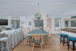 a kitchen and dining room with a table and chairs at 4603 - Yellow Brick Road in Southern Shores +28 photos