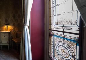 a door with a stained glass window in a room at Casa della Contessa Art Guest House in Turin +46 photos