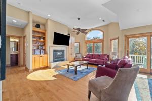 a living room with a couch and a fireplace at 3947 - Leg-O Duck in Duck