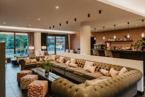a large living room with couches and a bar at Hotel Bernat de So in Llivia +43 photos