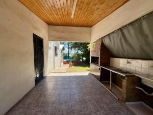 an empty hallway of a house with a wooden ceiling at La Pantera in San Antonio de Arredondo +1 photo