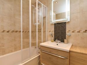 a bathroom with a sink and a shower at Seashells at Runswick Lodge in Saltburn-by-the-Sea +31 photos