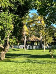 a park with a gazebo and some trees and grass at Pousada do Rei in Sarzedo