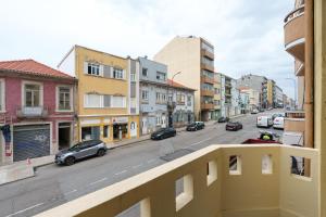a view from a balcony of a city street with cars at VIVA Serpa Pinto Serviced Apartments in Porto