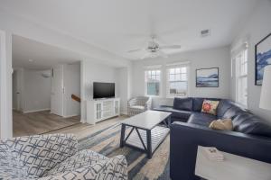 a living room with a couch and a tv at 7766 - Striper in Buxton
