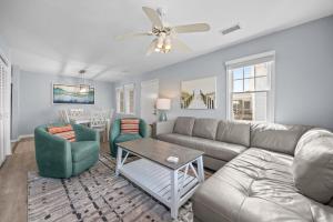 a living room with a couch and chairs and a table at 7767 - Swordfish in Buxton