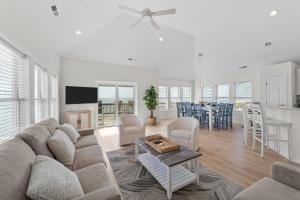 a living room with a couch and a table at 7029 - Just Breathe in Rodanthe