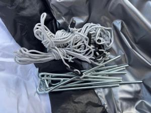a pile of metal needles sitting on top of a bag at Zelt im Garten in Ingolstadt