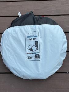 a white and black bag sitting on a table at Zelt im Garten in Ingolstadt